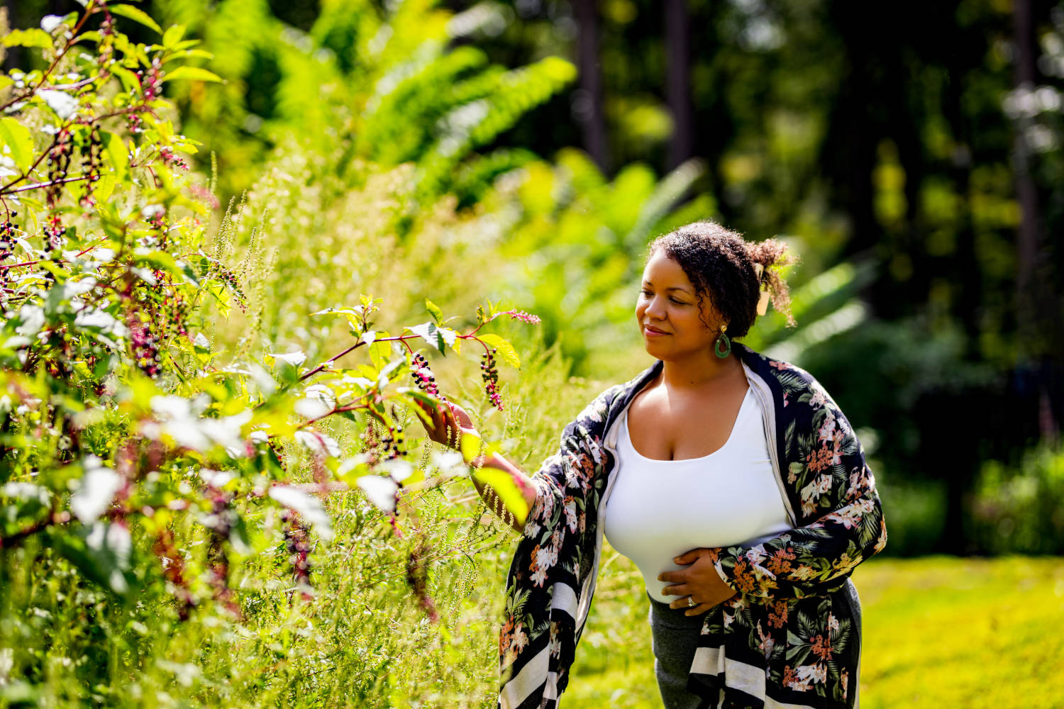 Dr. Toni Warner walking through a garden
